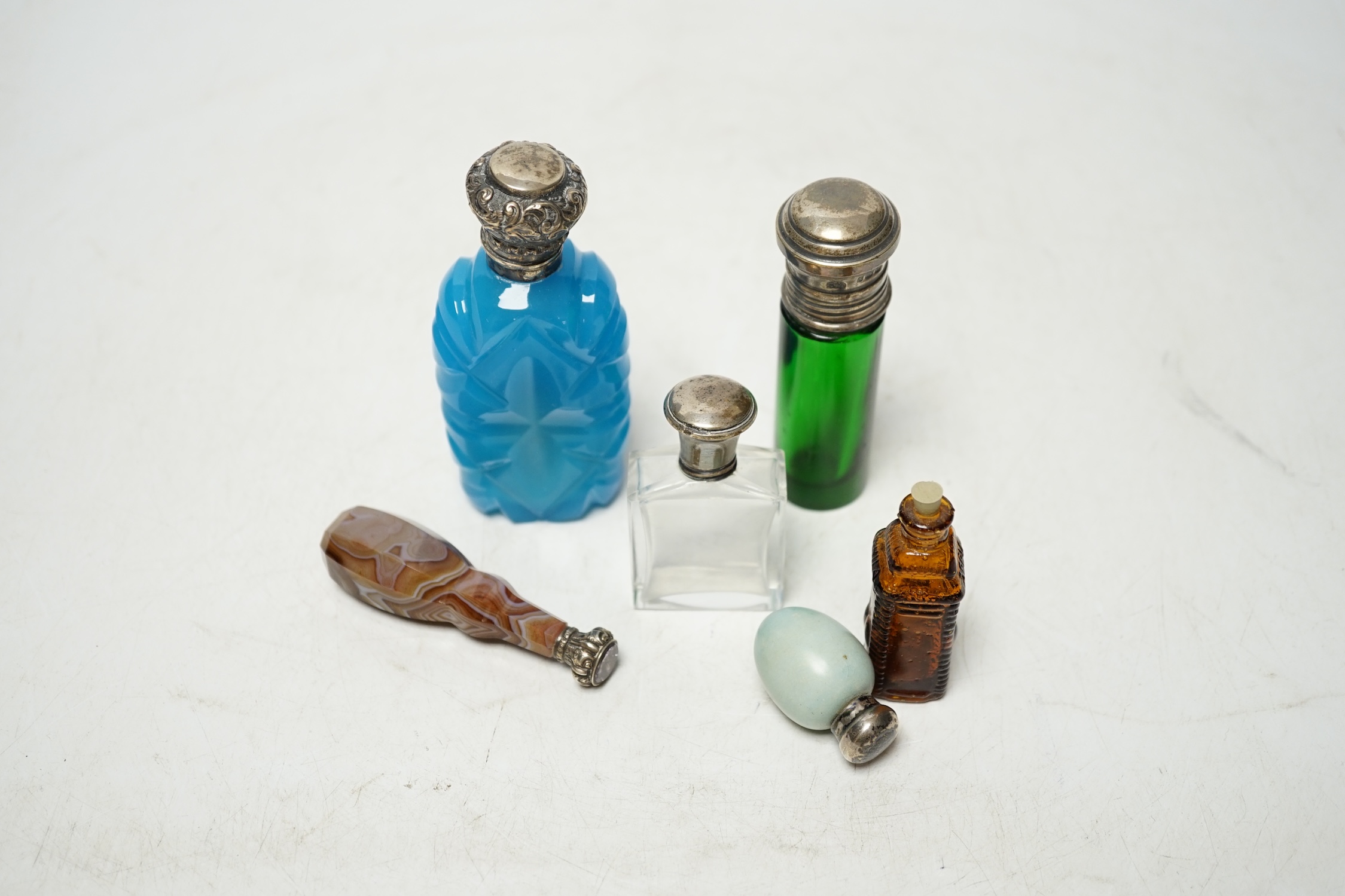 Five assorted mounted scent bottles including glass and ceramic egg shape, largest 94mm, together with a Victorian banded agate handled white metal desk seal. Condition - poor to fair